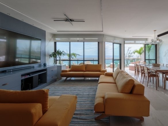 Lugar de convivência com vista para o mar, apartamentos de luxo, decoração moderna e confortável, ambiente interno aconchegante, espaço de lazer e varanda com vista para o oceano, residência de alto padrão, imóveis de luxo no litoral brasileiro.