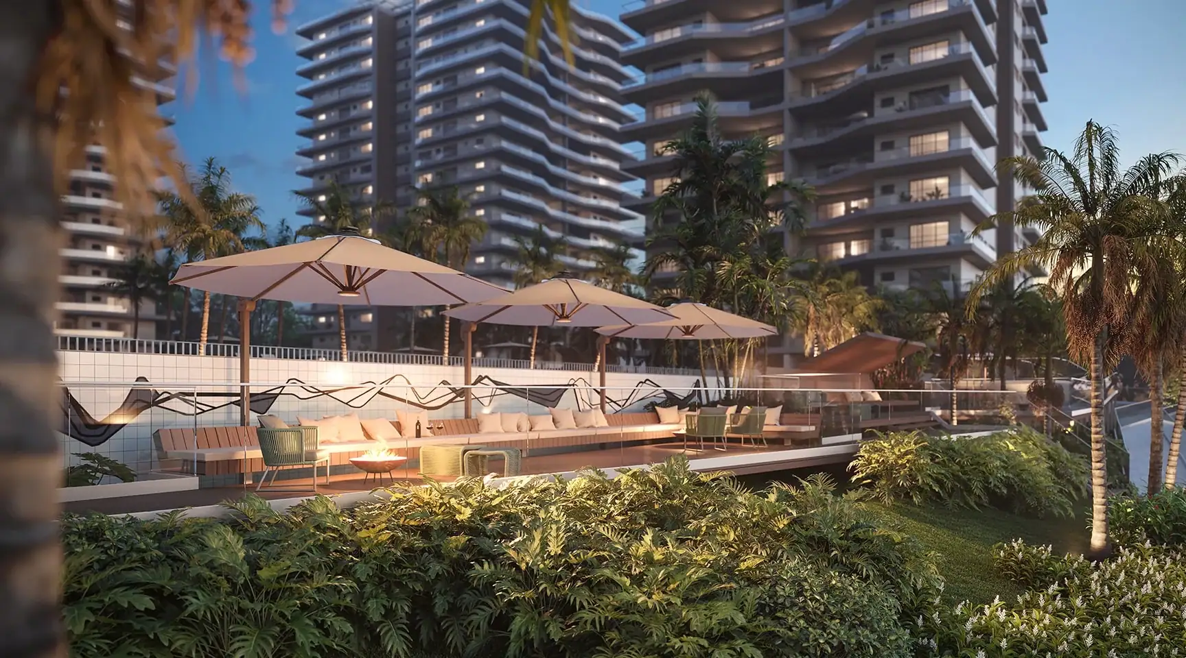 Luxuoso espaço de lazer ao ar livre no topo de edifício residencial com vista para torres modernas, áreas verdes, espreguiçadeiras, guarda-sóis, e decoração contemporânea, ideal para relaxamento e convivência.
