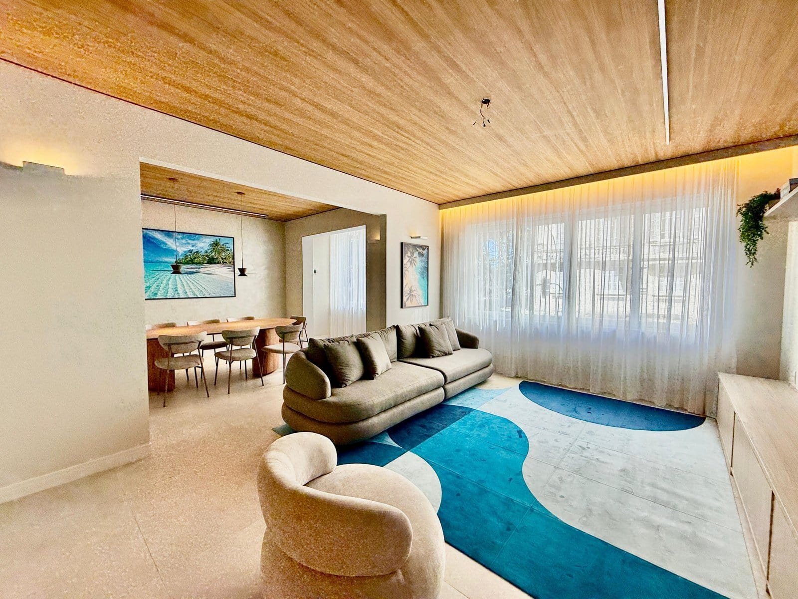 Floor-living-room-with-large-windows-bronze-ceiling-cozy-interior-design-urban-lifestyle-apt-architecture.